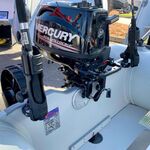 Railblaza Sideports in black stern mounted as rod holder socket.